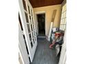 Front entryway with an open door revealing a glimpse into the hallway at 1053 N Colorado Blvd, Denver, CO 80206