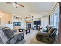 Spacious living room with fireplace and large windows at 738 S Main St, Byers, CO 80103