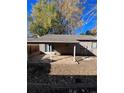 Covered patio with concrete slab and fenced backyard at 3658 S Norfolk Way, Aurora, CO 80013