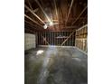 Empty garage with concrete floor and shelving at 3658 S Norfolk Way, Aurora, CO 80013