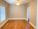 Spacious bedroom with hardwood floors and a ceiling fan at 523 W 8Th Ave, Denver, CO 80204