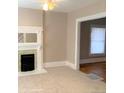 Open living room with hardwood floors and a fireplace at 523 W 8Th Ave, Denver, CO 80204