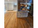 Kitchen with hardwood floors and a breakfast bar at 3006 S Fenton St, Denver, CO 80227