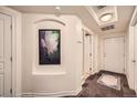 Bright condo entryway with tiled floor and artwork at 1705 Gaylord St # 107, Denver, CO 80206