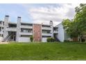Building exterior showcasing landscaping and a grassy area at 14218 E 1St Dr # A05, Aurora, CO 80011
