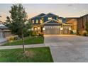 Two-story house with a charming facade and landscaped yard at 19184 W 85Th Blf, Arvada, CO 80007