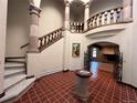 Elegant entryway with a grand staircase and tile floor at 26600 Mowbray Ct, Evergreen, CO 80439
