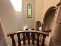 View of a grand staircase from the upper level at 26600 Mowbray Ct, Evergreen, CO 80439