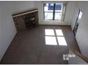 Living room with fireplace and large windows at 12093 W Cross Dr # 308, Littleton, CO 80127