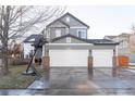 Two-story home with three-car garage and basketball hoop at 10935 Acadia, Parker, CO 80138
