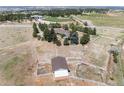 Aerial view of ranch property with barn and fencing at 7846 Village Rd, Parker, CO 80134