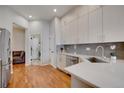 Modern kitchen with stainless steel appliances and hardwood floors at 6145 S Paris St, Greenwood Village, CO 80111