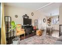 Bright living room with hardwood floors and comfy seating at 4876 S Pagosa Cir, Aurora, CO 80015