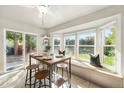 Bright kitchen with a breakfast nook and view of backyard at 9120 W 94Th Ave, Broomfield, CO 80021