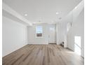 Spacious living room featuring hardwood floors and a neutral color palette at 2879 Taryn St, Erie, CO 80026