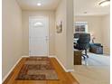 Bright entryway with hardwood floors and office area at 5526 Lewiston St, Denver, CO 80239