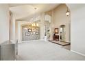 Elegant dining room with high ceilings and decorative wall at 7379 S Ukraine St, Aurora, CO 80016