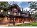 Multi-unit building exterior with stone, wood, and covered walkway at 1003 Boreas Pass Rd, Breckenridge, CO 80424