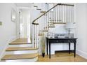 Classic staircase with hardwood floors and white railing at 740 12Th St, Boulder, CO 80302