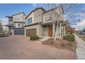 Two story townhome, brick paver driveway and walkway at 18561 E 53Rd Ave, Denver, CO 80249