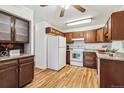 Bright kitchen with granite countertops and wood cabinets at 610 S Alton Way # 8D, Denver, CO 80247