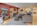 Living room with sectional sofa, fireplace, and built-in shelving at 9448 E Florida Ave # 1078, Denver, CO 80247