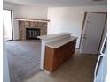 Kitchen with breakfast bar and access to living room at 12043 W Cross Dr # 201, Littleton, CO 80127
