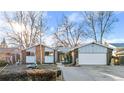 House exterior showcasing a ranch style home with mature trees and landscaping at 1151 S Nome St, Aurora, CO 80012