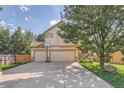 Two-story house with a three-car garage and basketball hoop at 18872 E Prentice Pl, Centennial, CO 80015