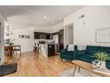 Modern kitchen with granite countertops, stainless steel appliances, and island at 15195 E 16Th Pl # 204, Aurora, CO 80011