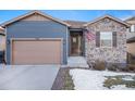 House exterior with stone and siding at 1170 Mcmurdo Cir, Castle Rock, CO 80108