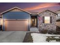 Beautiful ranch home with stone and siding exterior at 1170 Mcmurdo Cir, Castle Rock, CO 80108