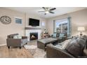 Spacious living room with fireplace and large windows at 1170 Mcmurdo Cir, Castle Rock, CO 80108