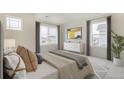 Spacious main bedroom with large windows and plenty of natural light at 4756 Windmill Dr, Brighton, CO 80601