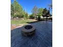 Stamped concrete patio with fire pit and spacious backyard at 6043 S Waco St, Aurora, CO 80016