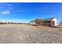 House with large yard and outbuilding at 41321 E 88Th Ave, Bennett, CO 80102