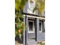 Charming two-story home with gray siding and small balcony at 2731 California St, Denver, CO 80205