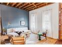 Spacious living room with modern furniture and large windows at 2731 California St, Denver, CO 80205