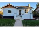 Charming craftsman home features a freshly painted exterior and manicured lawn at 1674 S Lincoln St, Denver, CO 80210