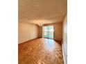 Living room with parquet floors and a chandelier at 1302 S Parker Rd # 226, Denver, CO 80231