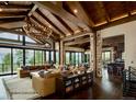 Spacious living room with high ceilings, stone accents, and large windows at 7474 Spring Drive, Boulder, CO 80303