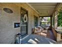 Charming front porch with seating area and decorative wreath at 2591 Ash St, Denver, CO 80207