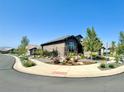 Stunning home exterior with curb appeal and nicely landscaped yard at 15797 Fishers Peak Dr, Broomfield, CO 80023