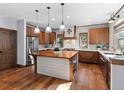 Modern kitchen with island and wooden cabinets at 4532 Shoshone Dr, Larkspur, CO 80118