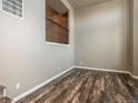 Living room with hardwood floors and large windows at 18189 E Saskatoon Pl, Parker, CO 80134