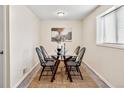 Bright dining room featuring a glass table and four chairs at 1516 Lafayette St, Denver, CO 80218