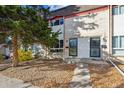 Brick townhouse exterior with a well-maintained front yard at 1289 S Monaco Pkwy, Denver, CO 80224