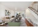 Living room featuring hardwood floors and a contemporary aesthetic at 1289 S Monaco Pkwy, Denver, CO 80224