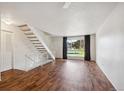 Bright living room with hardwood floors and access to exterior at 1289 S Monaco Pkwy, Denver, CO 80224