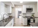 Modern kitchen with white cabinets, gray countertops and stainless steel appliances at 500 Manhattan Dr # B1, Boulder, CO 80303